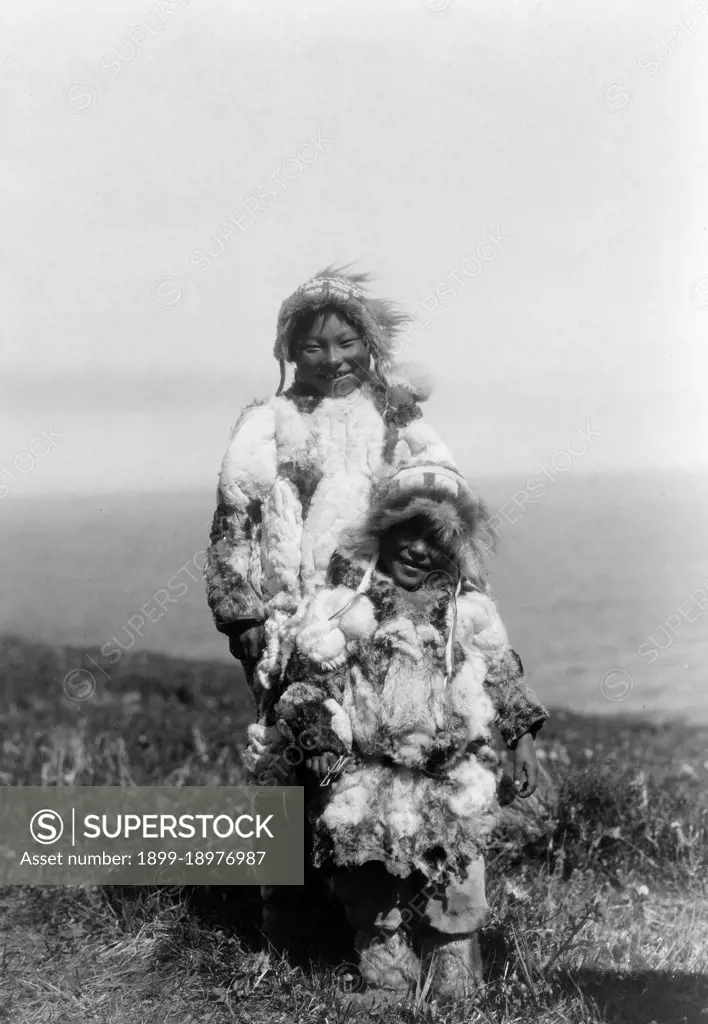 Edward S. Curtis Native American Indians -  Eskimo adult and child wearing duck-skin parkas ca. 1929. 