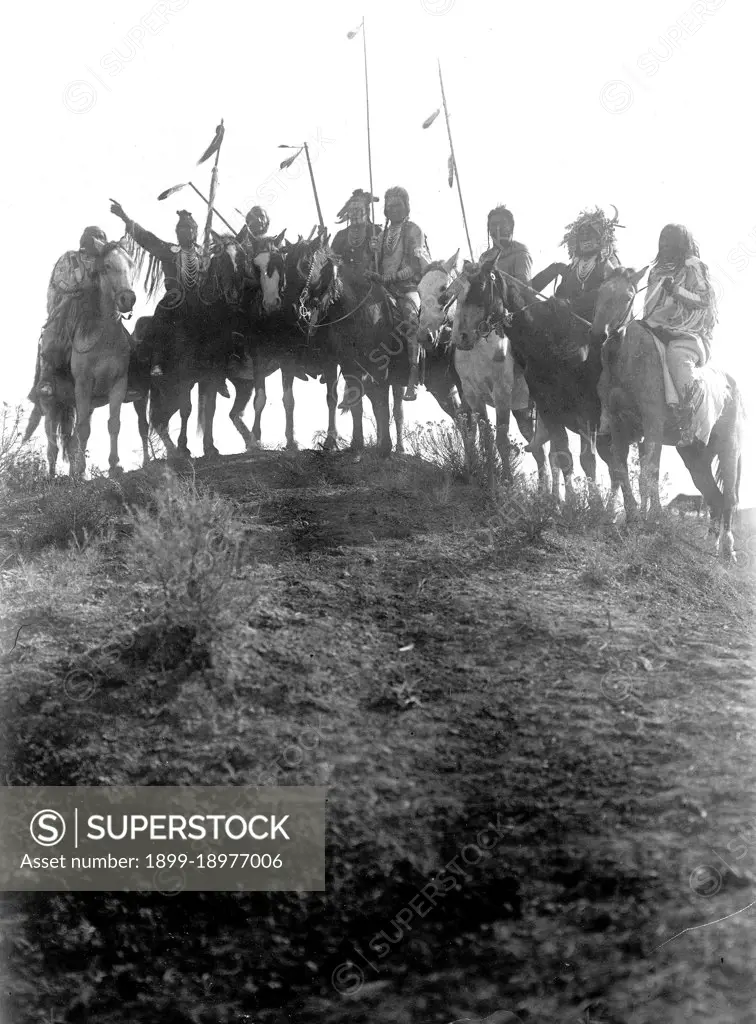 Edward S. Curtis Native American Indians - Eight Crow Indians on horseback, silhouetted on top of hill in Montana ca. 1908. 