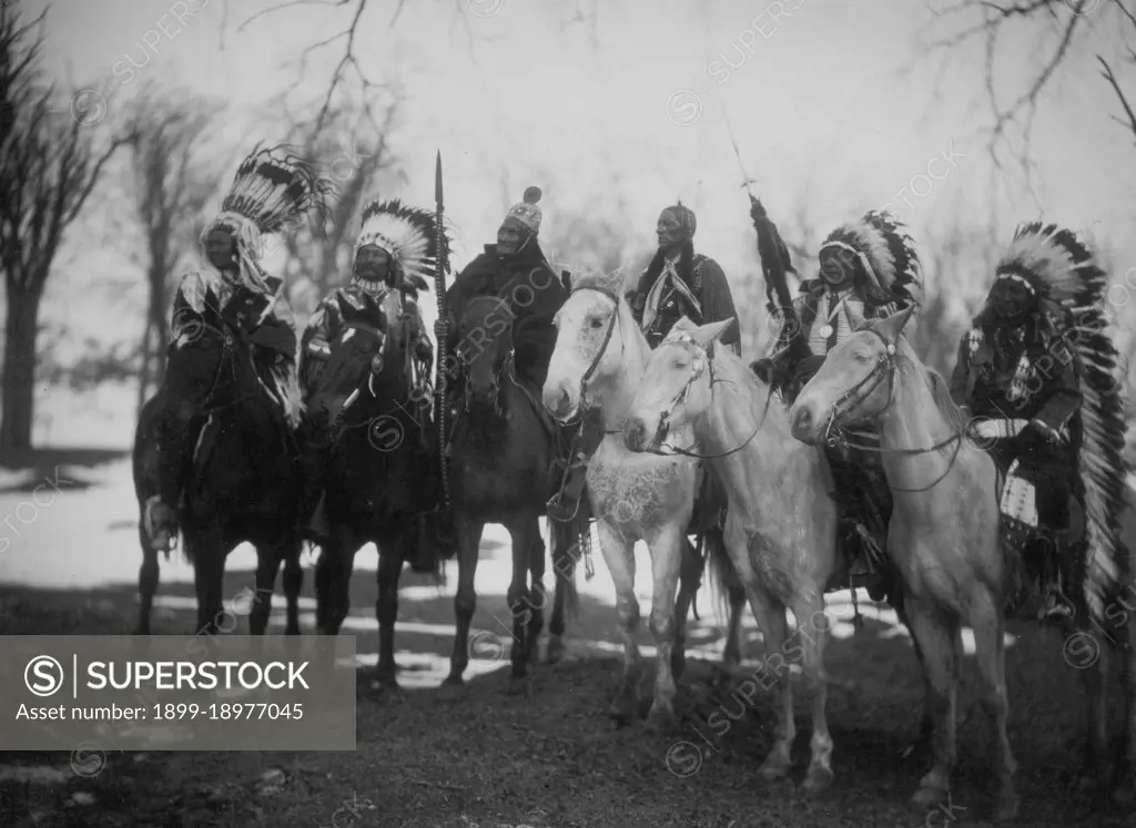 Six tribal leaders (l to r) Little Plume (Piegan), Buckskin Charley (Ute), Geronimo (Chiricahua Apache), Quanah Parker (Comanche), Hollow Horn Bear (Brulé Sioux), and American Horse (Oglala Sioux) on horseback in ceremonial attire. 