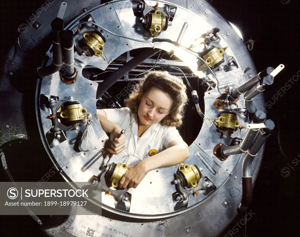 Part of the cowling for one of the motors for a B-25 bomber is assembled in the engine department of North American Aviation, Inc.'s Inglewood, Calif., plant - October 1942. 