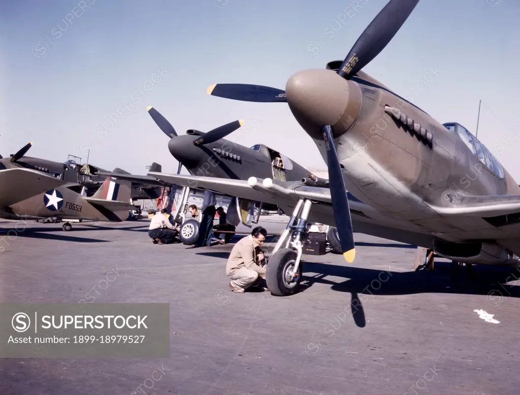 P-51 ('Mustang') fighter planes being prepared for test flight at the field of the North American Aviation, Inc., plant in Inglewood, Calif. - October 1942. 