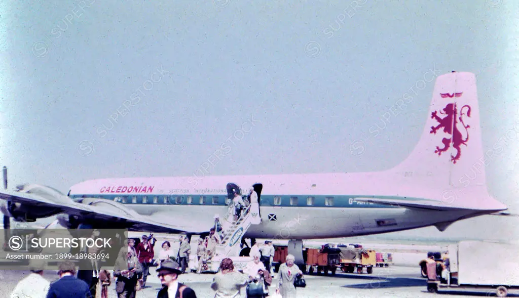 Passengers departing from an airplane at an unidentified airport in Israel . 