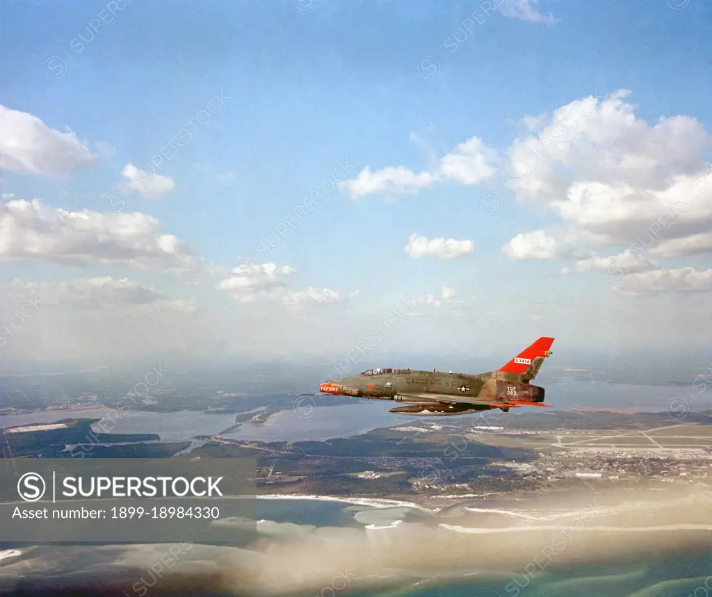 1981 - An air-to-air left side view of a QF-100D Super Sabre aircraft.. 