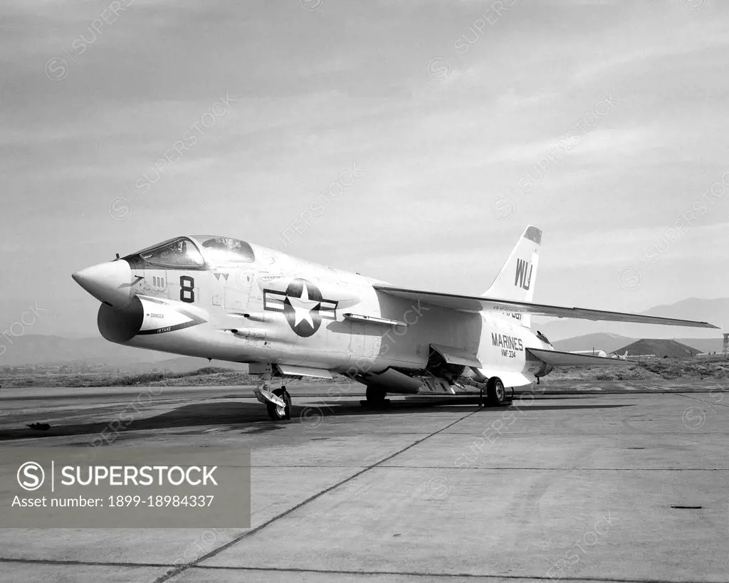 1966 - A left front view of an F-8C Crusader aircraft parked on the flight line.  The aircraft is assigned to Marine Fighter Squadron 334 (VMF-334). 