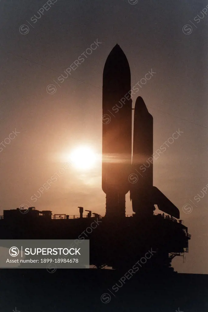 KENNEDY SPACE CENTER, Fla. --  Cast in silhouette by the rising sun, the Space Shuttle Atlantis slowly and carefully makes the journey along the Crawlerway between the Vehicle Assembly Building and Launch Pad 39A. Atlantis and its crew of seven are targeted for a May 15 launch. STS-84 will be the sixth Shuttle docking with the Russian Space Station Mir as part of Phase 1 of the International Space Station program. 