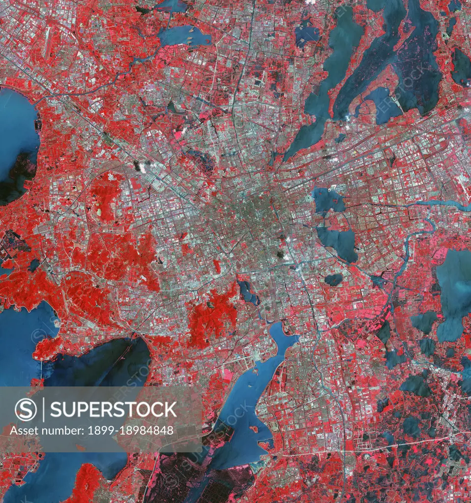 The Landsat TM image was acquired August 4, 1984, and the Aster image was acquired August 2, 2015. The images cover an area of 48 by 53 km, and are located at 31.2 degrees north, 120.4 degrees east.. 