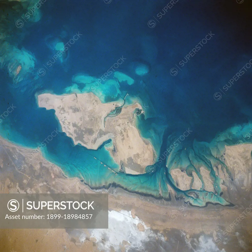 (28 April-6 May 1991) ---  A handheld 70mm frame of the southern Persian Gulf area. The island in the middle of the frame is Al Jirab, 30 miles west of Abu Dhabi in the United Arab Emirates.  On the mainland beaches opposite the island, a thick and continuous black fringe of oil can be seen as a line.  Photo experts studying the STS 39 photography have not yet ascertained the source of the oil.  They disclosed that if the oil does in fact stem from damaged Kuwaiti offshore oil fields, the slick has been blown southward at least 460 miles.  The city of Tarif is visible in the affected area. Lighter brown slicks can be seen offshore.  A causeway joins Al Jirab to the mainland and a dredged ship channel with its associated islands can be seen west of the causeway.. 