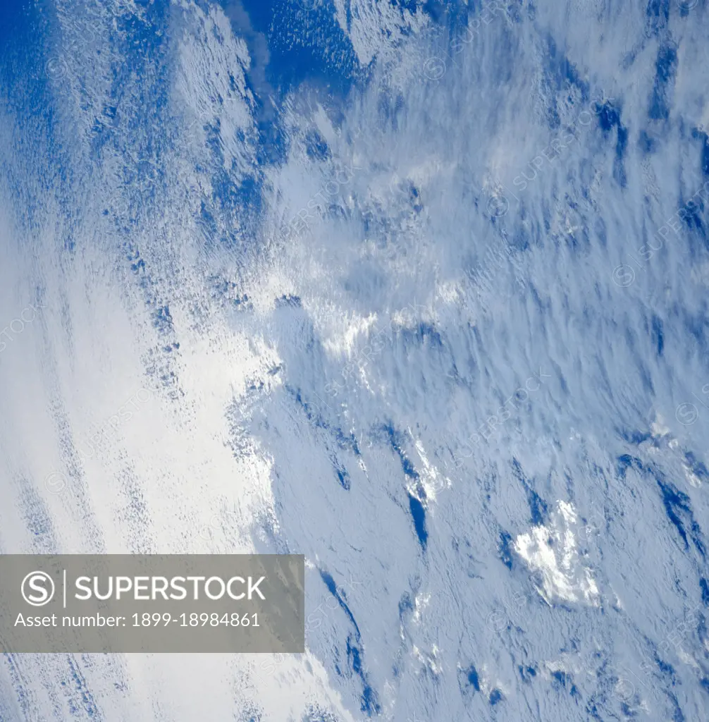 (28 April-6 May 1991) --- A variety of stratus clouds is represented in this picture. The clouds are backdropped against the sunglinted northern Pacific Ocean.  One of Discovery's seven crewmembers aimed a 70mm handheld camera through an overhead window on the aft flight deck to obtain the image.. 