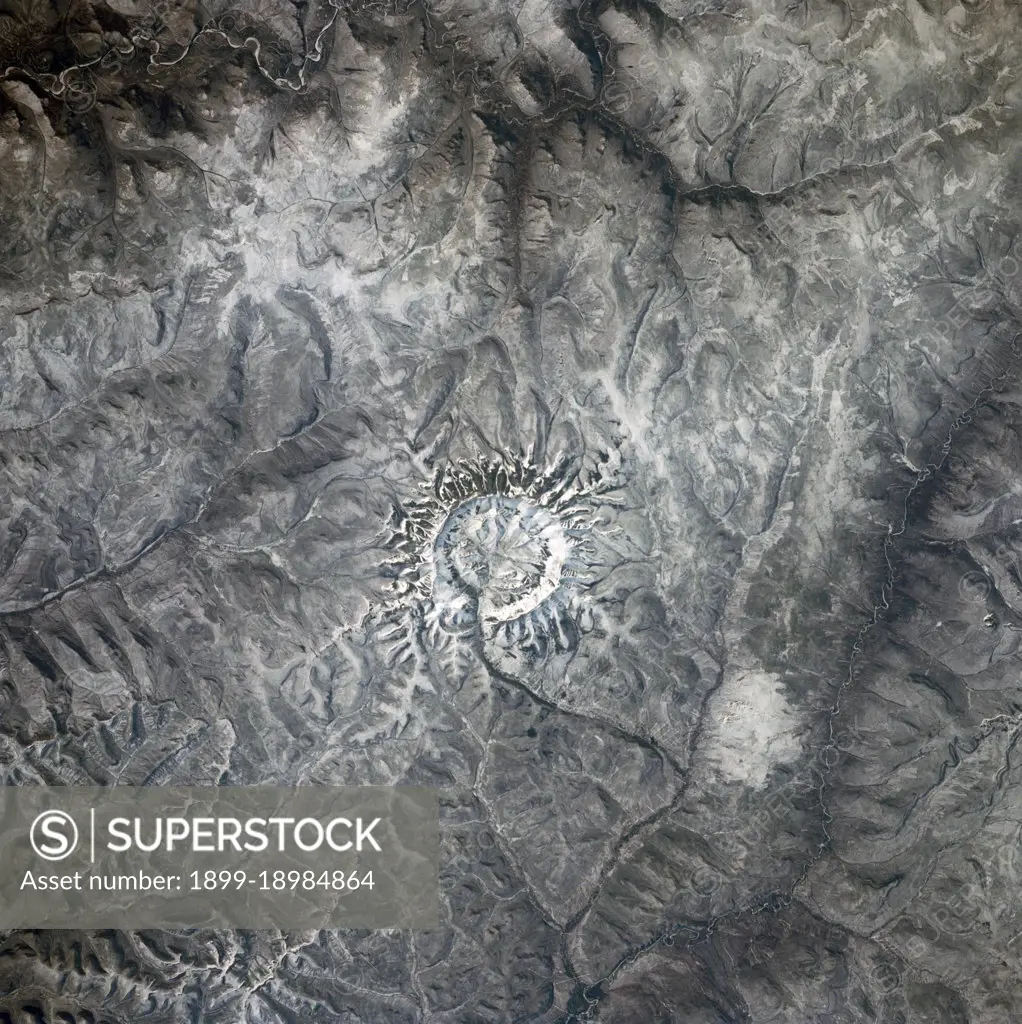 (28 April-6 May 1991) --- In the center of this 70mm frame, surrounded by mountainous terrain, is Gora Konder crater in the USSR.  The 57-degree inclination of Discovery's orbit allowed photographs of seldom observed areas of Earth such as this.  The picture was exposed with a 70mm handheld camera from overhead windows on Discovery's aft flight deck.. 