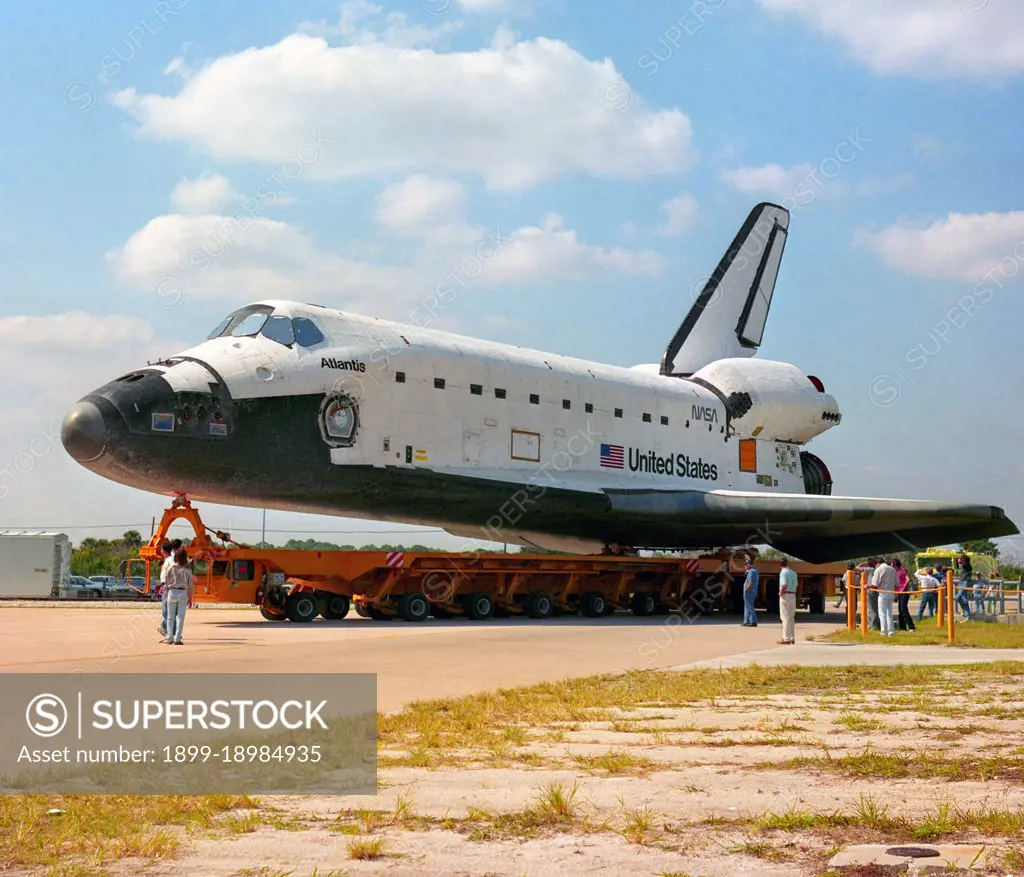 S91-50776 (18 Oct 1991) --- The Space Shuttle Atlantis is moved from the Orbital Processing Facility (OPF) Bay 2 to the Vehicle Assembly Building (VAB) at Kennedy Space Center, Florida.  The Atlantis will be mated with the external fuel tank and solid rocket boosters before it is transported to Pad 39A, where it will launch a Department of Defense payload, Mission STS-44, in late 1991.. 