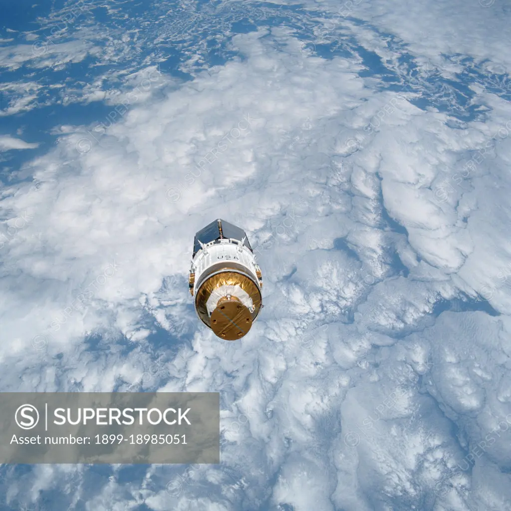 (2 Aug 1991)  --- The Tracking and Data Relay Satellite (TDRS-E), is backdropped against an interesting cloud pattern over blue water soon after leaving the payload bay of the Earth-orbiting Space Shuttle Atlantis.  . 