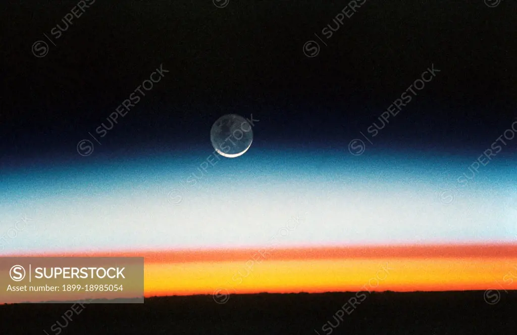 (22 Oct.-1 Nov. 1992) --- As the Space Shuttle Columbia orbited Earth in an easterly direction over the Indian Ocean, moonrise was followed quickly by sunrise.. 