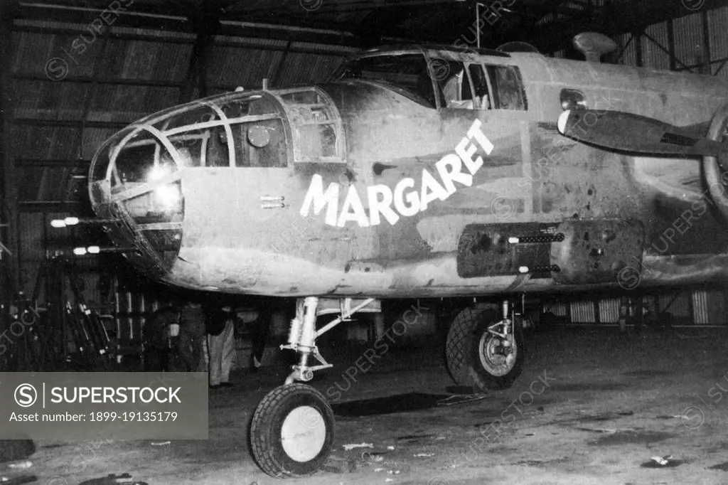 USA/Australia: B-25 Mitchell medium bomber gunship 'Margaret' of the 90th Squadron, 3rd Bomb Group in a hangar at Garbutt airfield, Queensland, c. 1942