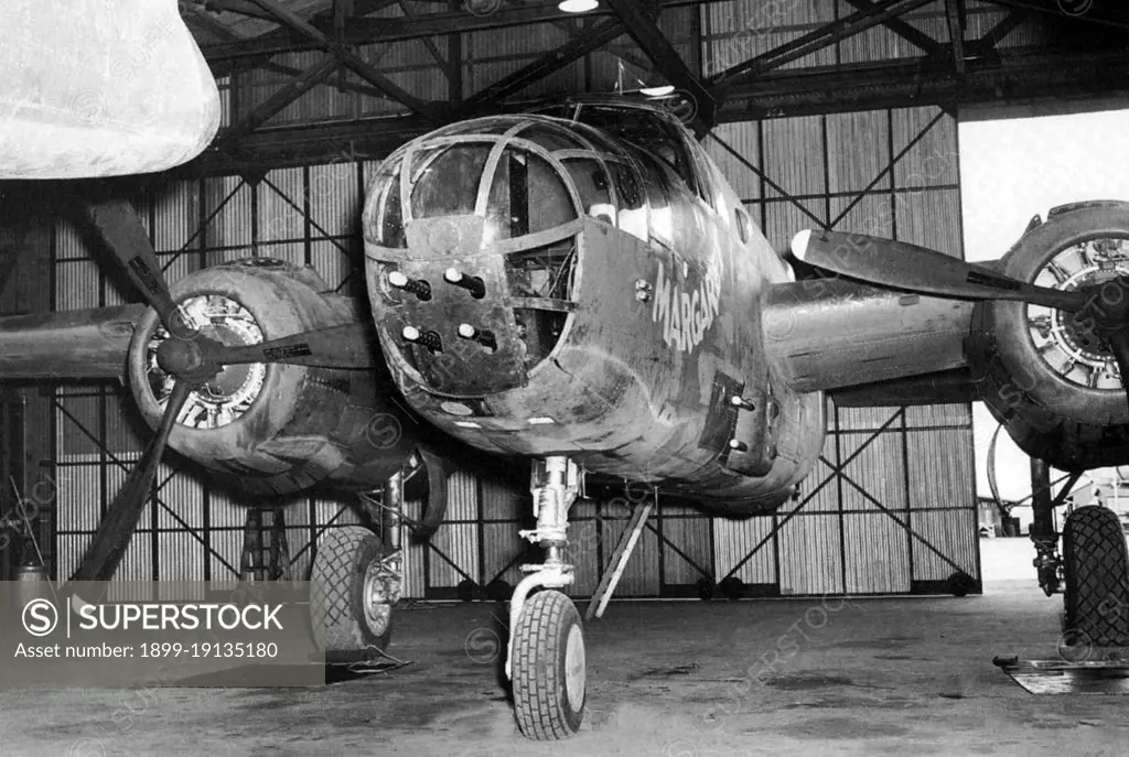 USA/Australia: B-25 Mitchell medium bomber gunship 'Margaret' of the 90th Squadron, 3rd Bomb Group in a hangar at Garbutt airfield, Queensland, c. 1942