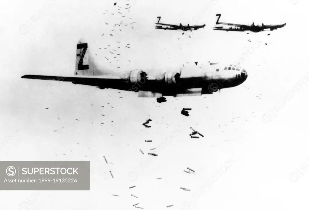 USA/Japan: A flight of USAAF B-29 bombers release incendiary bombs on Yokohama in May 1945