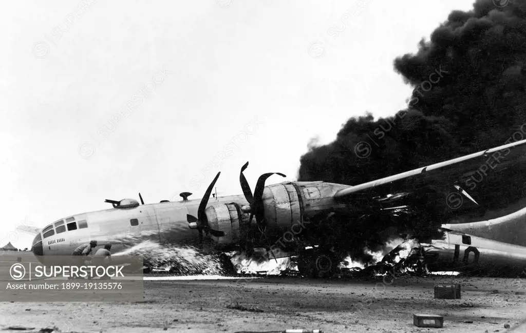 Japan/USA: A Boeing B-29 in flames after an emergency landing at Iwo Jima, Battle of Iwo Jima, March 1945