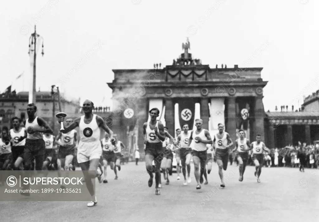 Germany: Runners at the Brandenburg Gate at the start of the 1936 Summer Olympic Games, Berlin, 1936