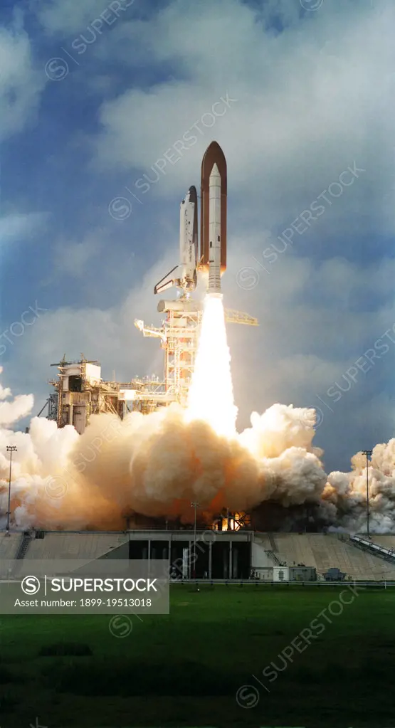 (22 March 1982) --- The space shuttle Columbia, with its third crew aboard, two solid rocket boosters (SRB) and external fuel tank (ET) are photographed as they clear the launch pad at Kennedy Space Center's Launch Complex 39. Astronauts Jack R. Lousma, STS-3 commander, and C. Gordon Fullerton, pilot, were in Earth orbit some ten minutes later looking ahead to seven days of work in space. The external tank is unpainted for the first time, appearing a dark orange in the color photos and dark gray in black and white.