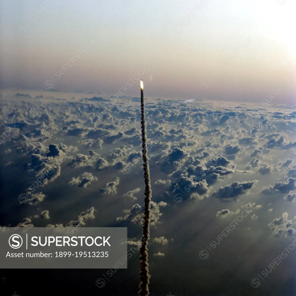 Aerial views of the STS-5 launch from T-38 chase aircraft Nov. 11, 1982. Shuttle Columbia can be seen as a small figure trailed by a line of smoke.