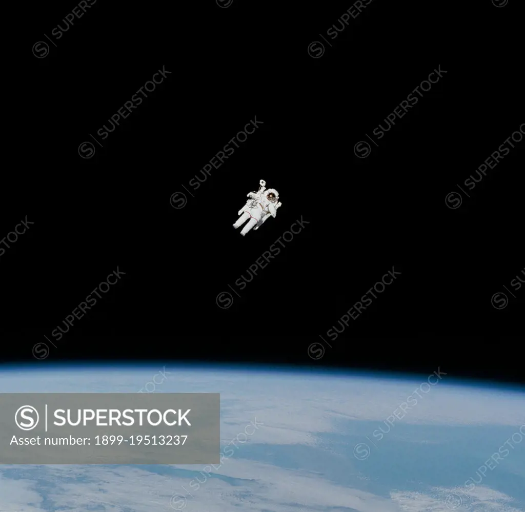 (7 Feb 1984) --- Astronaut Bruce McCandless II approaches his maximum distance from the Earth-orbiting Space Shuttle Challenger in this 70mm frame photographed by his fellow crewmembers onboard the reusable vehicle.