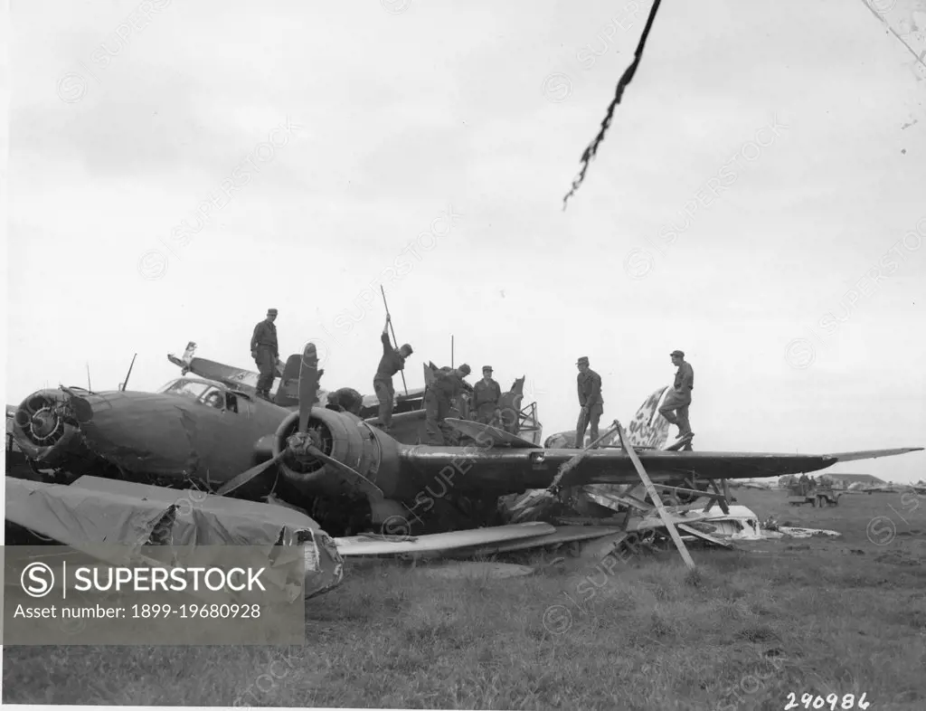 United States military personnel of the occupying forces are shown puncturing the wing tanks of Japanese warplanes to prevent explosions when they were burned at Kumagaya Airfield. The entire Japanese airfleet was scrapped, Honshu, Japan, 10/1945. (US Army/Signal Corps/GG Vintage Images/UIG)