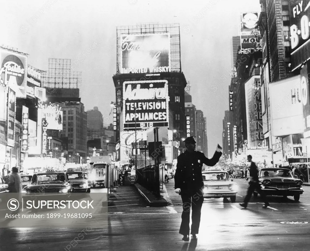 A policeman directs traffic at 7th Avenue and 42nd Street in Times Square, New York, NY, 1967. (Photo by New York Convention and Visitors Bureau/GG Vintage Images)