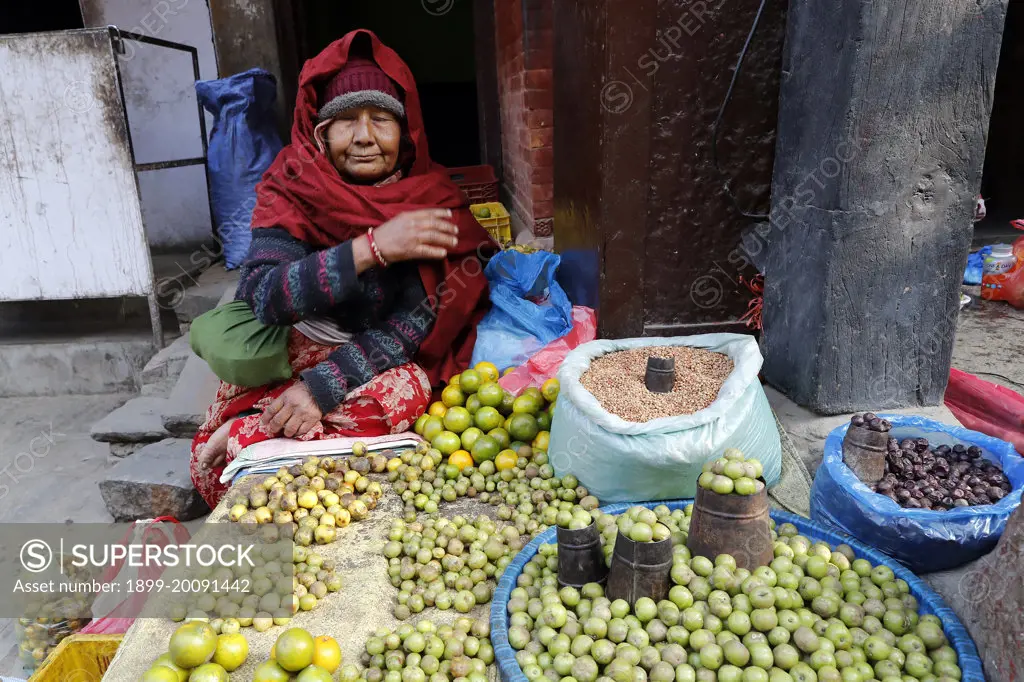 Woman selling lemons in the street..