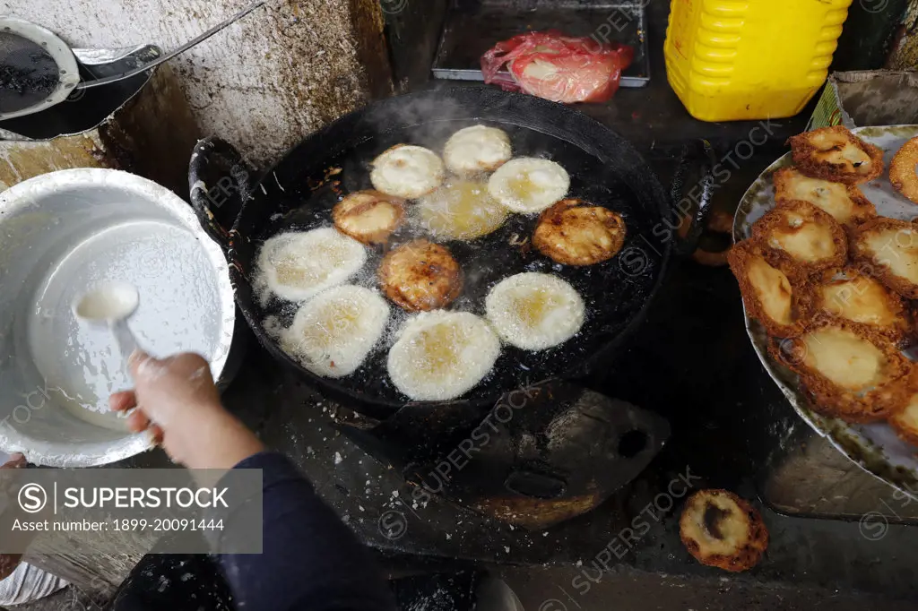 Traditional nepalese restaurant.   Fried Sel Roti, the traditional breakfast for nepali people..