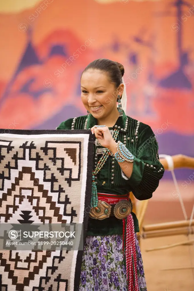 Navajo Indian woman displays a Navajo rug, Gallup Inter-Tribal Indian Ceremonial, Gallup, New Mexico