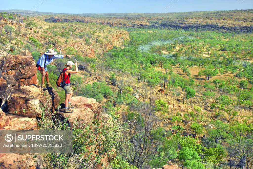 Clifftop tourists (Butch Maher, left) and Anja Skrobin)   in Kimberley wilderness.  Marion Downs Wildlife Sanctuary, northern Western Australia