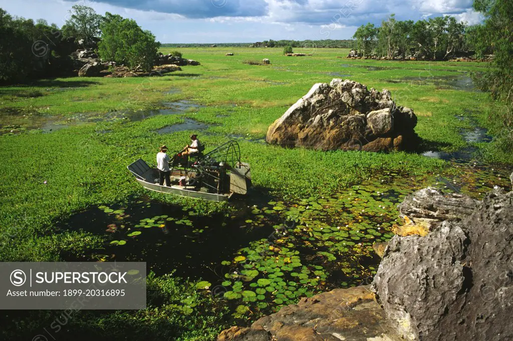 Mount Borradaile Safari Camp:  boat on a weed-choked lagoon.  Arnhem Land, Northern Territory, Australia