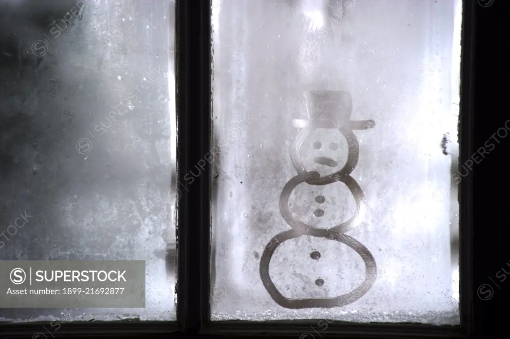 Snowman image on frosty window. (Photo by: Edwin Remsburg/VW Pics)