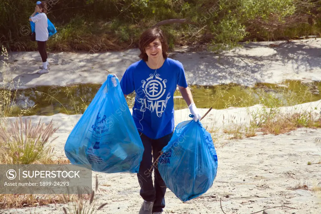 Cleaning up the Glendale narrows. FoLAR' (Friends of the LA River) annual river cleanup. Thousands of volunteers at 14 sites pulled out accumlated trash, mostly plastic bags, from river runoff that might normally find it's way downstream into the Pacific Ocean. 