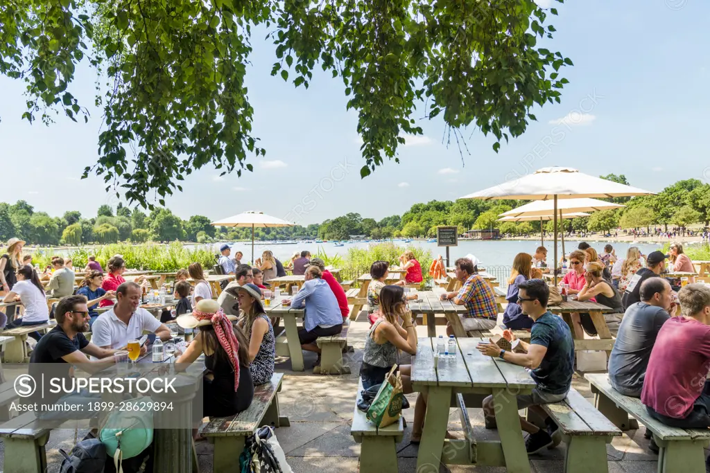 Busy cafe bar beside the Serpentine, Hyde Park, London, UK