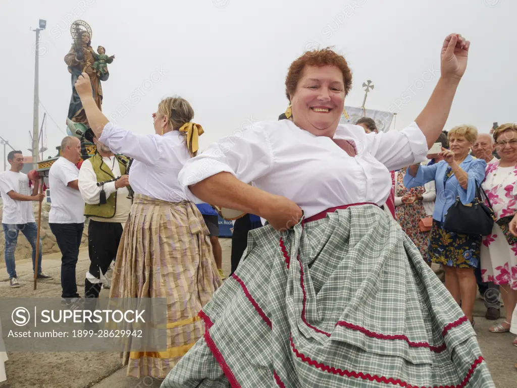 Mature women having fun dancing during village festival, Corrubedo,  Galicia, Spain - SuperStock