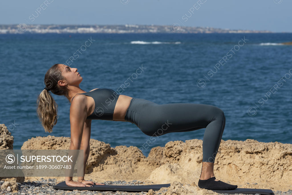 Malia, Crete, Greece, Pilates exercises on the beach in Crete