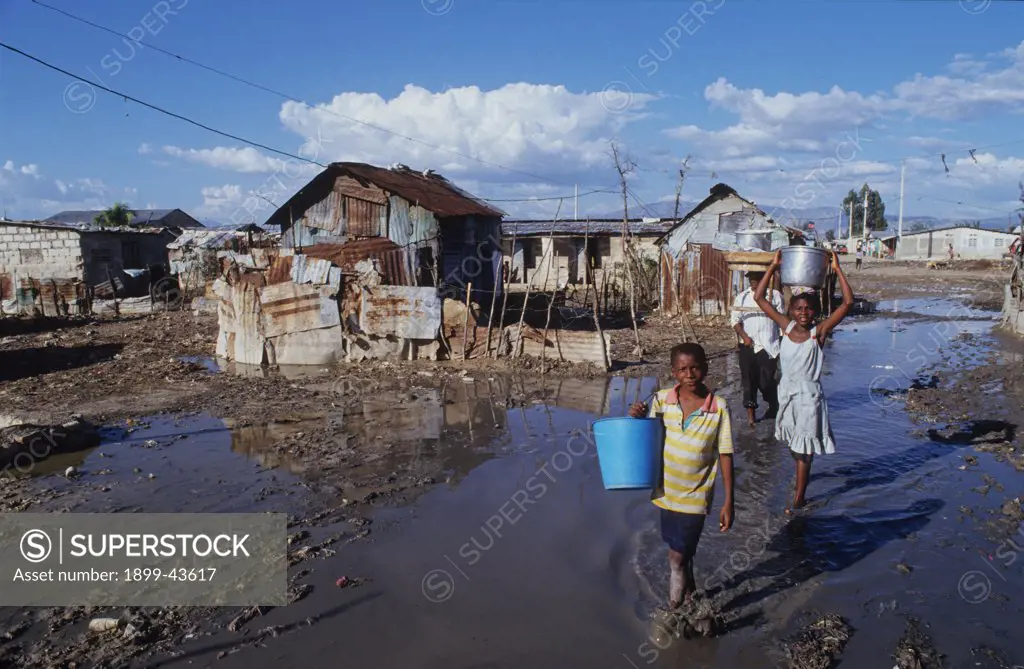 SLUMS, HAITI. Cite Soleil Shanty Town. Port-au-Prince. . As the top soil leaves the countryside so do the peasants. These environmental refugees are among the most disadvantaged people in the world. 