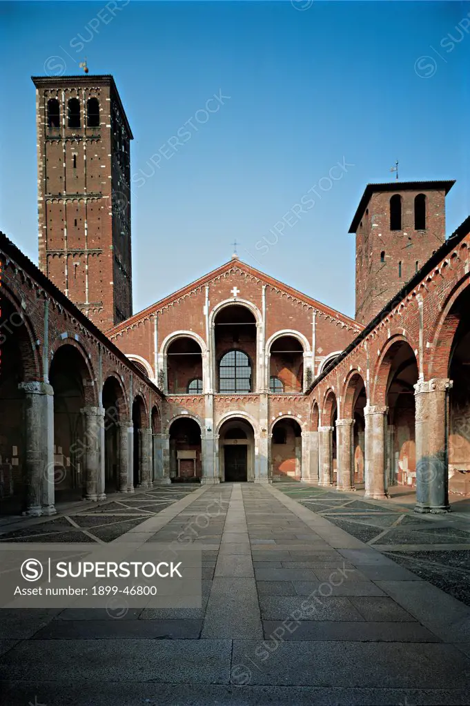 St Ambrose Basilica in Milan, by Unknown artist, 1080, 11th Century, unfaced brick. Italy: Lombardy: Milan: Sant'Ambrogio Basilica. Axial view exterior quadriporticus colonnade church saddle/sloping facade loggia arcades bell towers bicolor white red