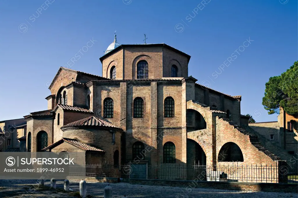 Basilica of San Vitale in Ravenna, by Unknown artist, 1526, 6th Century, unfaced brick (exterior), marble cladding (interior). Italy: Emilia Romagna: Ravenna: San Vitale basilica. Whole artwork. Exterior basilica San Vitale in Ravenna church central octagonal plan pilaster-strips pillars buttresses dome cladding round arch windows one-light windows apse