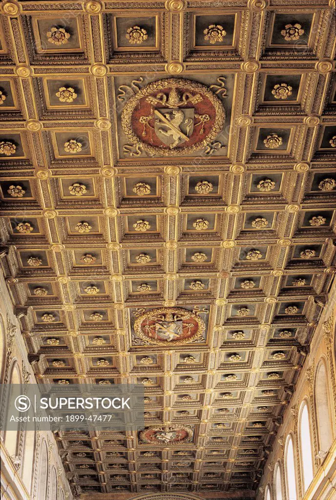 Coffered/Caissoned ceiling, by De'Dolci Giovannino, 1465 - 1468, 15th Century, Unknow. Italy, Lazio, Rome, San Marco Basilica. View coffered ceiling caisson wood inlay marquetry painted and decorated strips with ribbon-like decoration coffers caissons with framed flowers coat of arms.