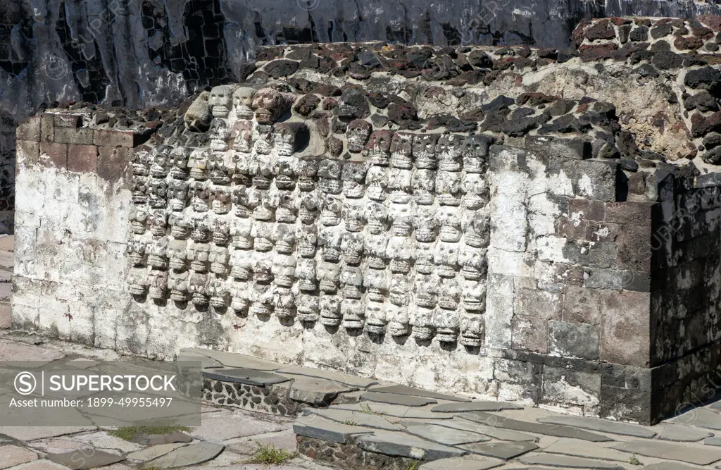 Wall of stone skulls called Tzompantli, archaeological site and museum of Templo Mayor, Mexico City, Mexico.