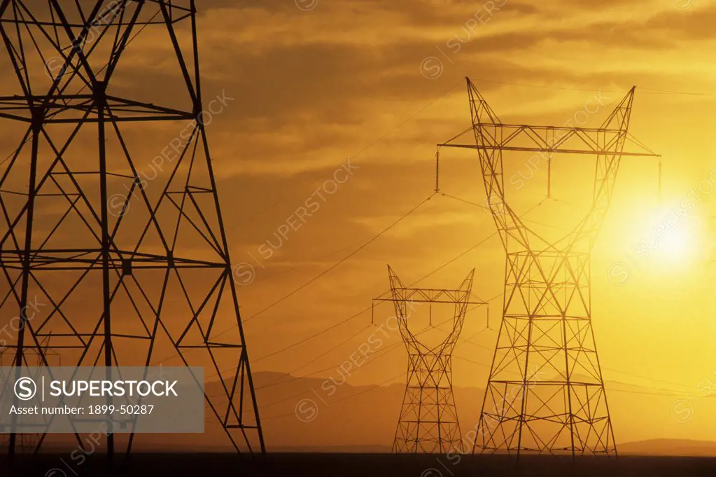 Electricity pylons that supply power from Hoover Dam, also known as Boulder Dam.   Near Boulder City, Nevada, USA.