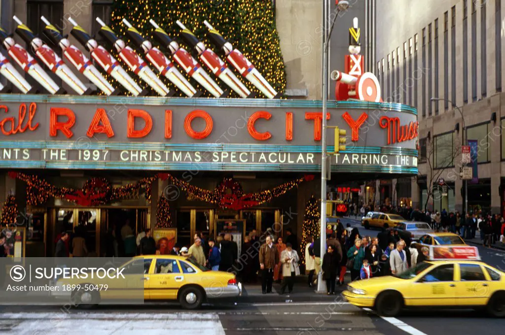 New York City, Manhattan. Exterior Of Radio City Music Hall With Sign For 1997 Christmas Spectacular.