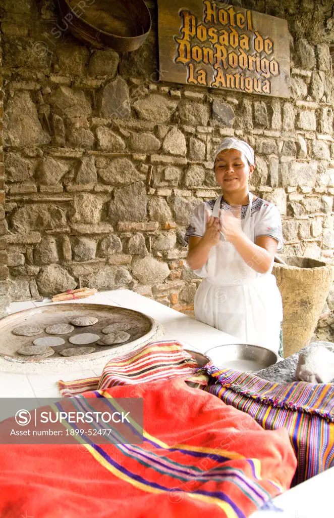 Woman Making Bread Tortillas In Antigua, Guatemala