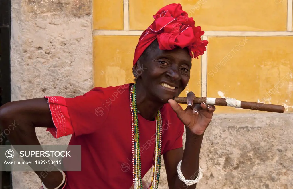 Cuban Woman In Red With Cigar In Old Havana, Cuba