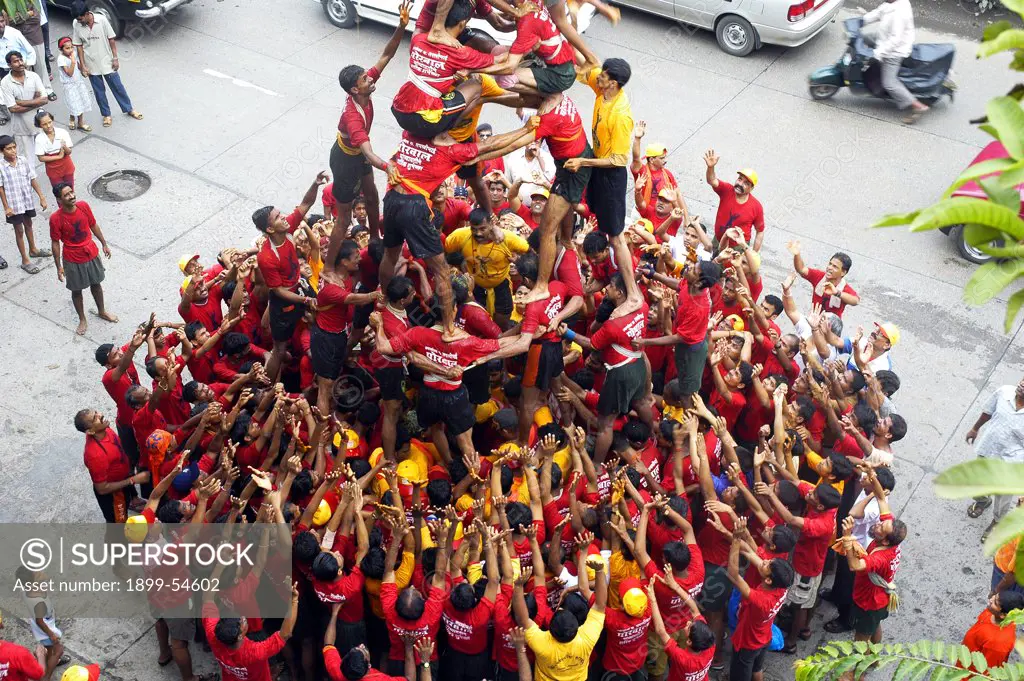 Indian Festival Janmashtami Lord Krishna Birthday Celebrated By Human Pyramid Breaking Pot Of Curd