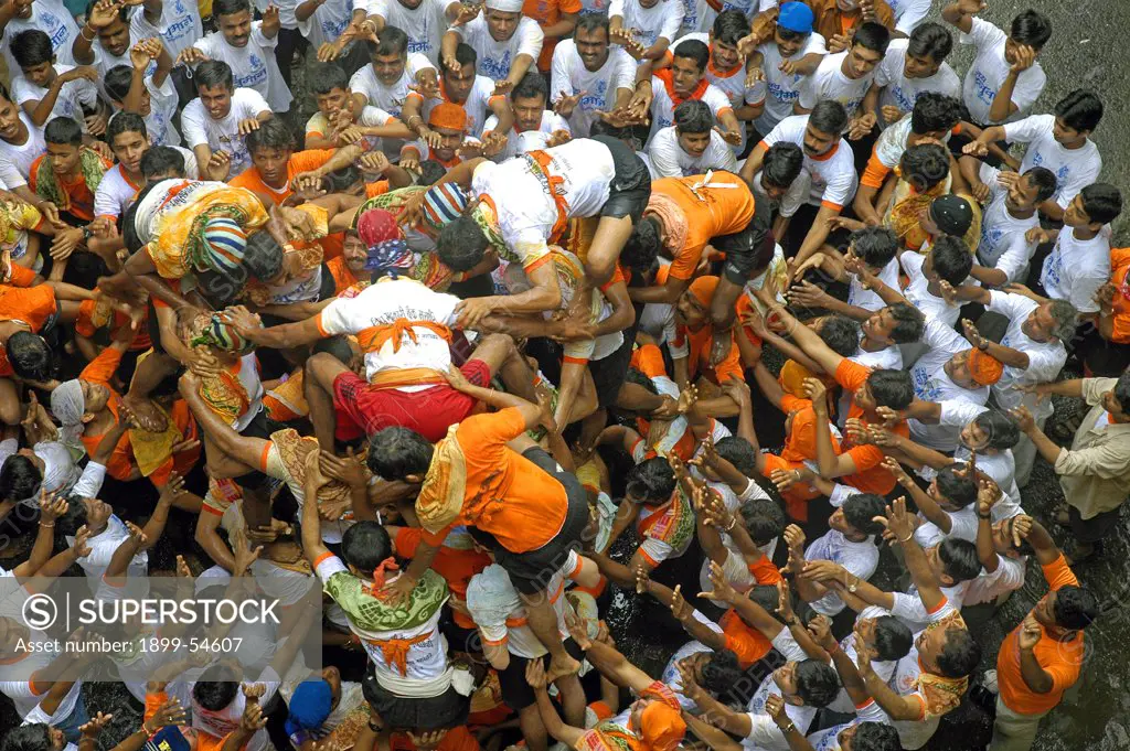 Indian Festival Janmashtami Lord Krishna Birthday Celebrated By Human Pyramid Breaking Pot Of Curd