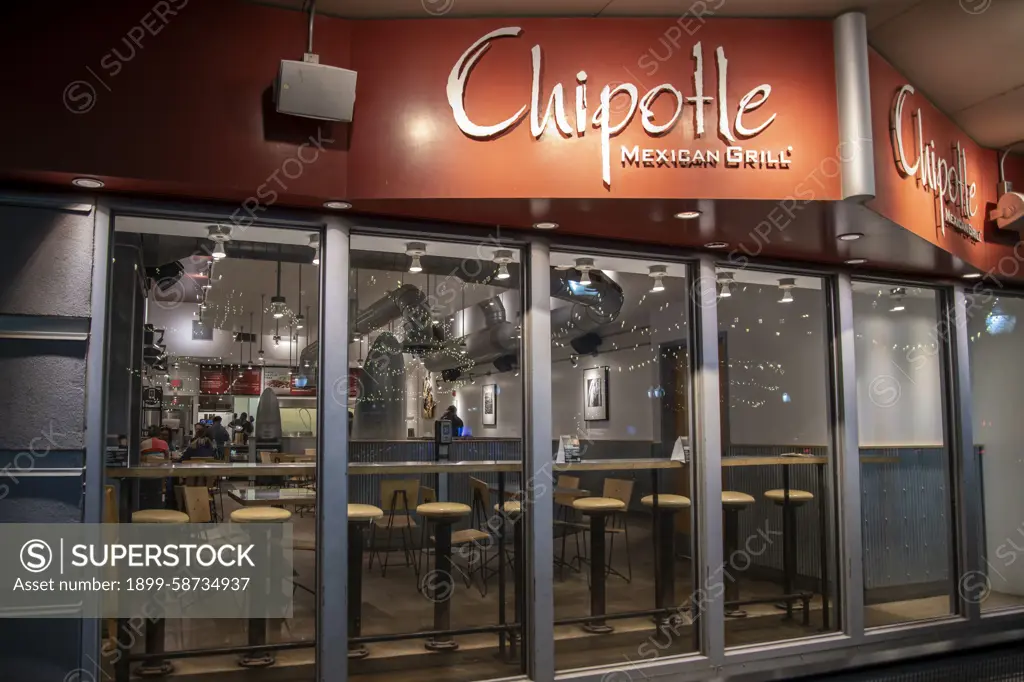 Lawrence, Kansas. Chipotle Mexican Grill on main street at night in downtown Lawrence.