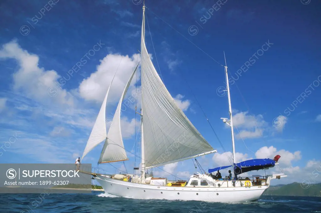 A Large Sailing Ship Under Blue Skies