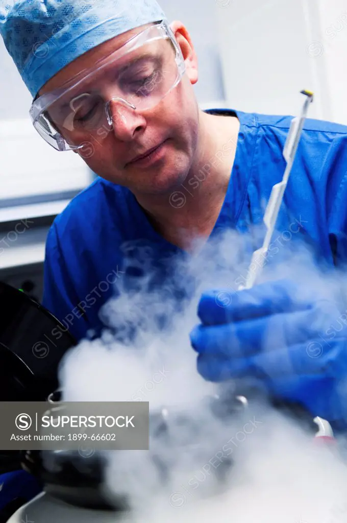 Doctor removing embryo samples from cryogenic storage